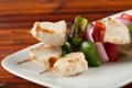 Cubed chicken kabobs plate closeup Royalty Free Stock Photo