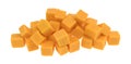Cubed mild cheddar cheese on a white background