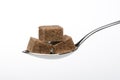Cubes of brown sugar on a spoon Royalty Free Stock Photo