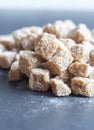 Cubes of brown whole cane sugar, shallow focus