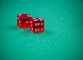 Cubes on casino green felt poker table Royalty Free Stock Photo
