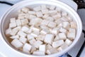 Cubes of celery root in boiling water Royalty Free Stock Photo