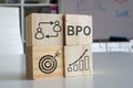 Cubes with diagrams symbolizing BPO business process outsourcing.