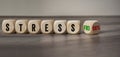 Cubes, dice or blocks with the german word for stressfree - stressfrei and stress 100% on wooden background