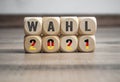 Cubes, dice or blocks with the german words for federal election 2021 - bundestagswahl 2021 with a red cross Royalty Free Stock Photo