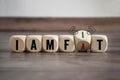 Cubes, dice or blocks with the opposite between fit and fat on wooden background