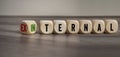 Cubes, dice or blocks showing the words external and internal on wooden background Royalty Free Stock Photo