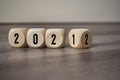 Cubes, Dice Or Blocks With 2021 And 2022 On Wooden Background