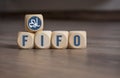 Cubes and dice with LIFO and FIFO accounting on wooden background Royalty Free Stock Photo