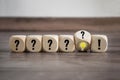 Cubes and dice with Idea on wooden background