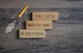 Cubes and dice showing the words Make it Happen on wooden background