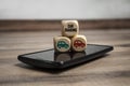 Cubes and dice with smartphone and car sharing app