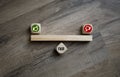 Cubes and dice with thumbs up and down fair yes or no on wooden background Royalty Free Stock Photo