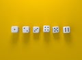 Cubes dice two white dices on yellow background Royalty Free Stock Photo