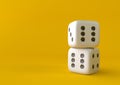 Cubes dice two white dices on yellow background Royalty Free Stock Photo