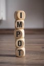 Cubes dice on wooden background with the french word for taxes