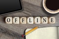 Cubes and dice on a wooden desk with the word Offline Royalty Free Stock Photo