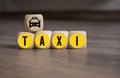 Cubes and dice with word taxi and taxi icon