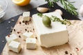 Cubes of feta cheese and spices on board Royalty Free Stock Photo