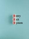 Cubes form the acronym EES- Entry Exit System. Beautiful blue background. Business concept Royalty Free Stock Photo
