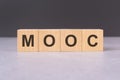 cubes form the word mooc. mooc word concept - finance, market and investment