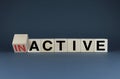 Cubes form words Inactive or Active. The concept of activity both in business and in life