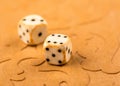 Cubes and game pieces on a backgammon board Royalty Free Stock Photo
