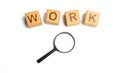 Cubes labeled work with magnifying glass. Concept of job search or workers. hiring specialists and specialized workers. Search