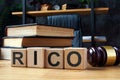 Cubes with letters RICO Racketeer Influenced and Corrupt Organizations Act and gavel.