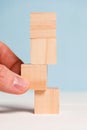 Cubes made of wood on a blue background. Concept of change and new plan. Close up Royalty Free Stock Photo