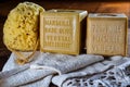 Cubes of marseilles natural soap with sponge and bath towel