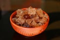 Cubes of organic palm tree rock sugar in a bowl on a black background