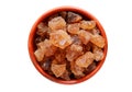 Cubes of organic palm tree rock sugar candy in a bowl isolated on a white background, Clipping path included