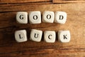 Cubes with phrase GOOD LUCK on wooden table Royalty Free Stock Photo
