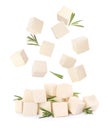 Cubes of raw tofu falling into pile on white background Royalty Free Stock Photo