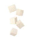 Cubes of raw tofu falling on white background Royalty Free Stock Photo