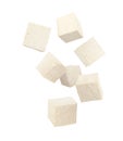 Cubes of raw tofu falling on white background Royalty Free Stock Photo