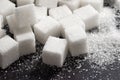 Cubes of refined sugar on a dark table close-up Royalty Free Stock Photo
