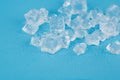 Cubes and shards of ice on a blue background in the water Royalty Free Stock Photo