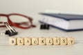 Cubes with word Blacklist and office stationery on white wooden desk, closeup Royalty Free Stock Photo