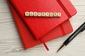 Cubes with word Blacklist and office stationery on white wooden desk, flat lay Royalty Free Stock Photo