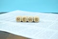 Cubes with the word news on a newspaper Royalty Free Stock Photo