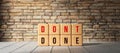 Cubes with the words DON`T and DONE - 3D rendered illustration
