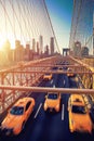 Cubs speeding at sunset on Brooklyn Bridge, Manhattan. One of the most iconic bridges in the world, New York City Royalty Free Stock Photo