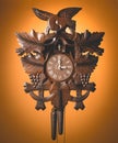 Cuckoo clock hanging on a rustic wooden wall Royalty Free Stock Photo