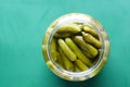 Cucumber cornichons or pickle in a container top view . Royalty Free Stock Photo