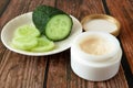 Cucumber cosmetic cream face and hand on silver background, skin and body care hygiene moisture lotion, closeup