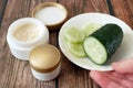 Cucumber cosmetic cream face and hand on wooden background, skin and body care hygiene moisture lotion