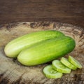 Cucumber fruit on wood