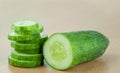 Cucumber half and Slices on wood table background Royalty Free Stock Photo